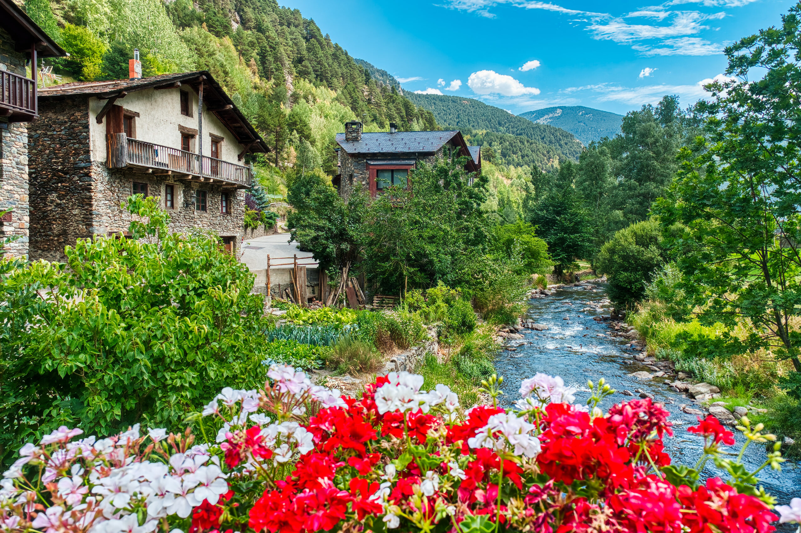 Stone houses and river in Ordino, Andorra